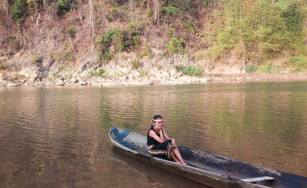wooden boat on Dak Bla river
