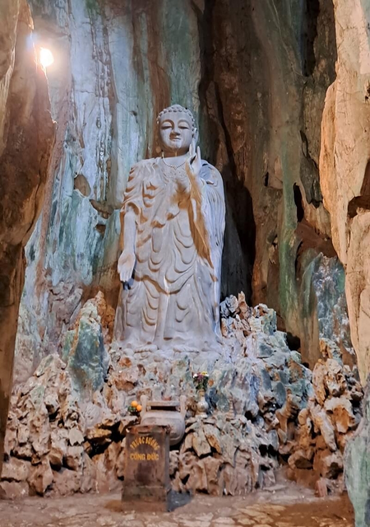 statue in cave in marble mountain